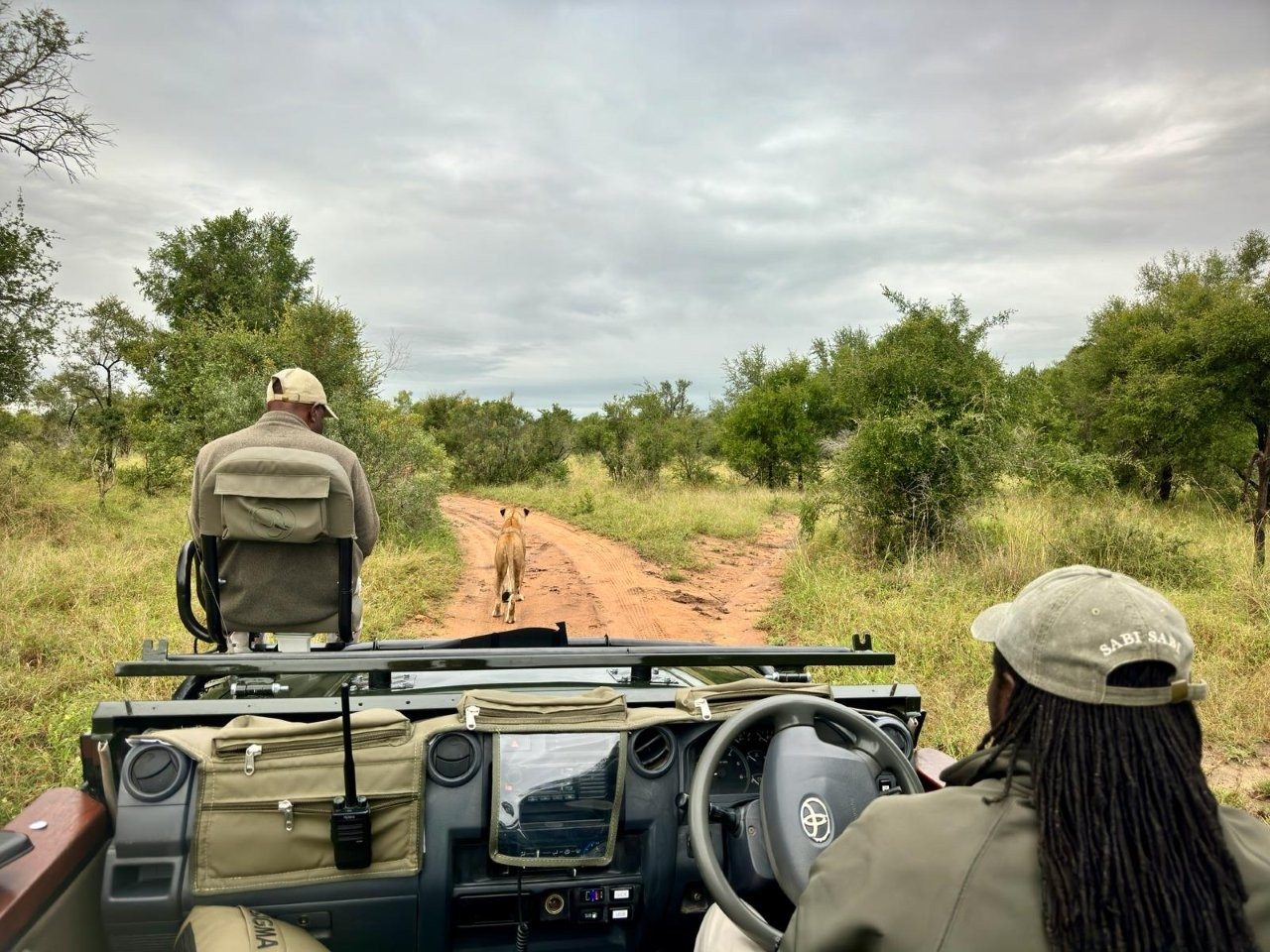 Mike Ndlovu sharing tracking knowledge with a fellow ranger in the field.
