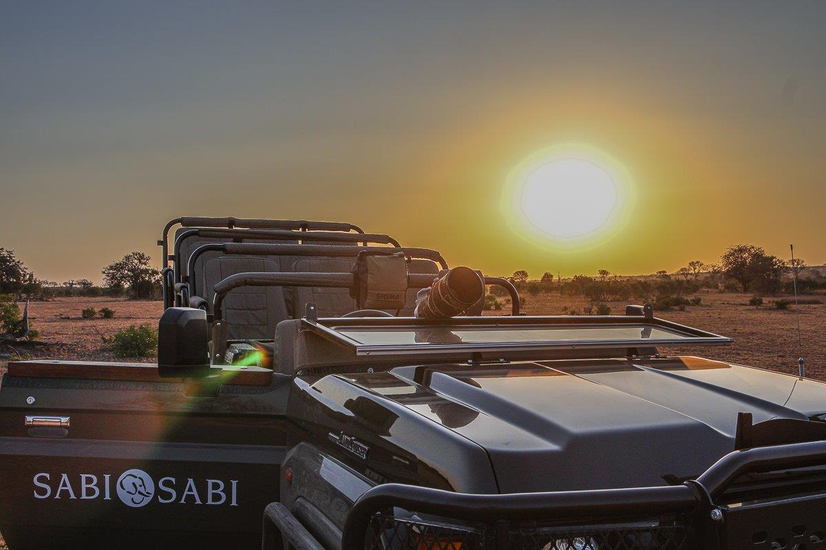 A stunning sunset in the Sabi Sabi Reserve, casting a golden hue over the landscape. A stunning sunset in the Sabi Sabi Reserve, casting a golden hue over the landscape.