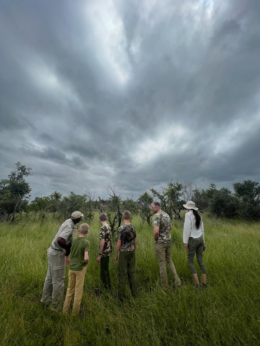 Guides and guests tracking wildlife on foot in the Greater Kruger area Guides and guests tracking wildlife on foot in the Greater Kruger area
