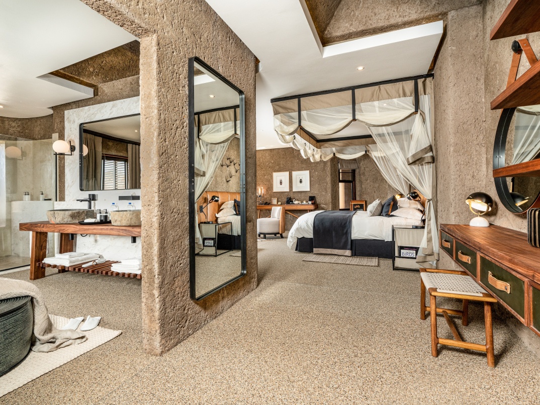 Indulge in the opulence of a luxurious dressing area in your Sabi Sabi Earth Lodge suite.