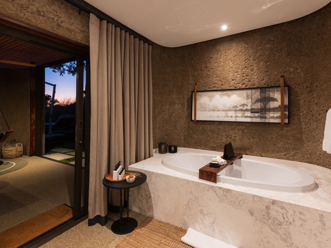 Marble ensuite bathroom and panoramic windows create a flawless balance of privacy and spaciousness. Marble ensuite bathroom and panoramic windows create a flawless balance of privacy and spaciousness.