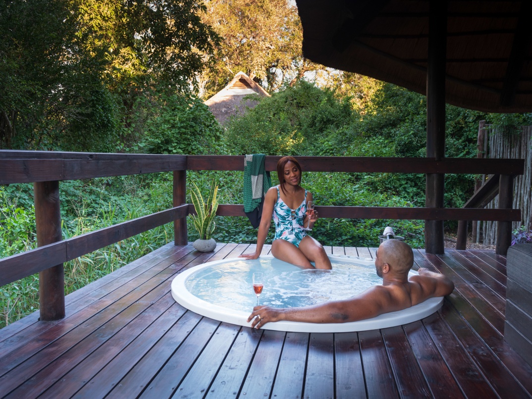 Guests enjoying their private jacuzzi at Sabi Sabi Little Bush Camp. Guests enjoying their private jacuzzi at Sabi Sabi Little Bush Camp.
