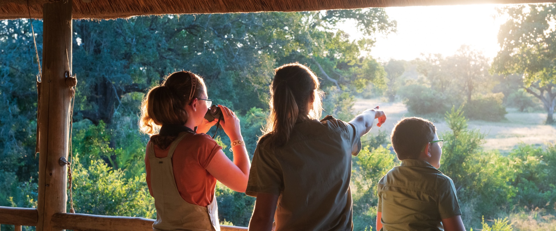 Kids exploring the beautiful Sabi Sabi reserve with a professional guide.