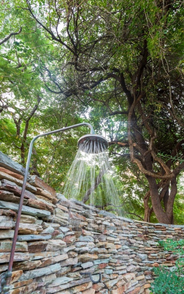 Relaxing outdoor shower in your private Selati Camp luxury suite garden.