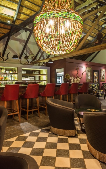 Step into opulence at the exquisitely furnished lounge, atrium, and bar area at Bush Lodge, Sabi Sabi. Step into opulence at the exquisitely furnished lounge, atrium, and bar area at Bush Lodge, Sabi Sabi.