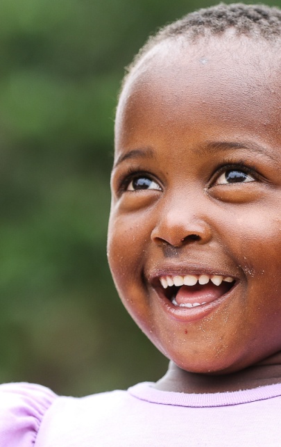 Smiling local community girl radiates joy. Smiling local community girl radiates joy.