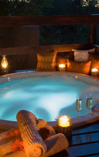 Unwind in a private jacuzzi at Sabi Sabi, love's bliss under the stars. Unwind in a private jacuzzi at Sabi Sabi, love's bliss under the stars.