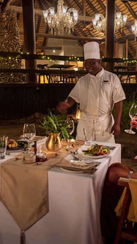 Indulge in open-air boma feasts, kindled by central firelight and vibrant camaraderie.