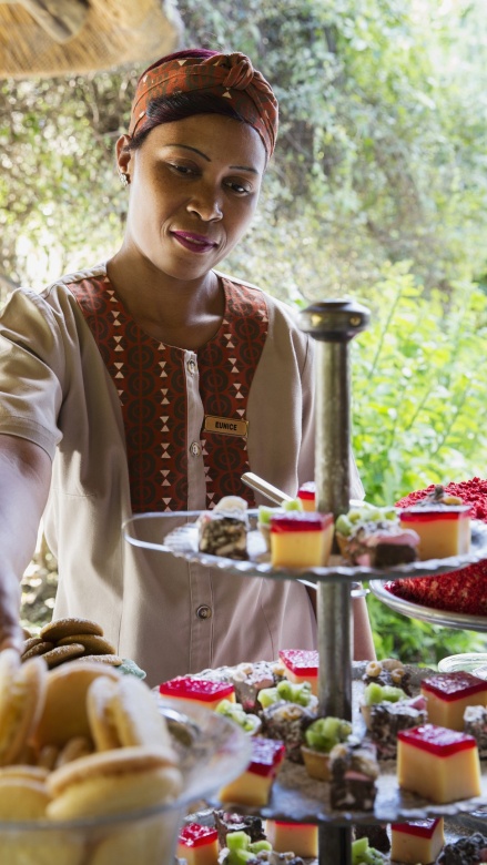 Friendly staff serving high tea at Sabi Sabi Private Game Reserve. Friendly staff serving high tea at Sabi Sabi Private Game Reserve.