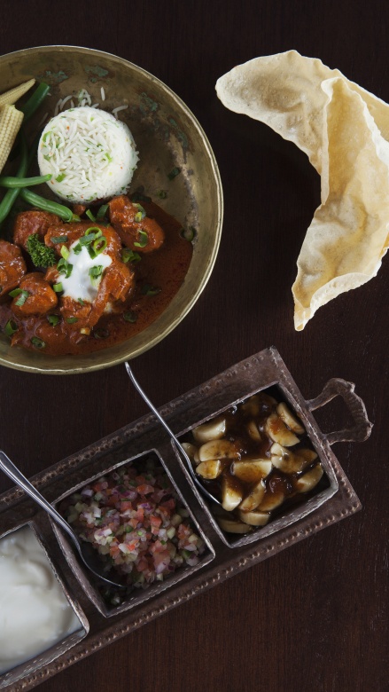 Savor aromatic chicken curry, a culinary delight at Sabi Sabi.