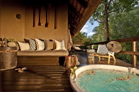 Relax in a private jacuzzi on the deck overlooking the bush at Little Bush Camp. Relax in a private jacuzzi on the deck overlooking the bush at Little Bush Camp.