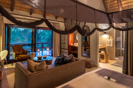 Sabi Sabi Little Bush Camp Luxury Suite lounge flows out onto a private deck. Sabi Sabi Little Bush Camp Luxury Suite lounge flows out onto a private deck.