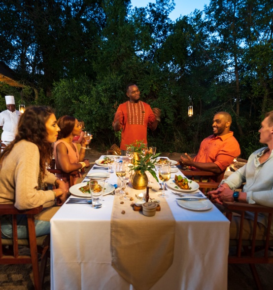 Group of Sabi Sabi guests dining under the starlight at the Little Bush Camp. Group of Sabi Sabi guests dining under the starlight at the Little Bush Camp.