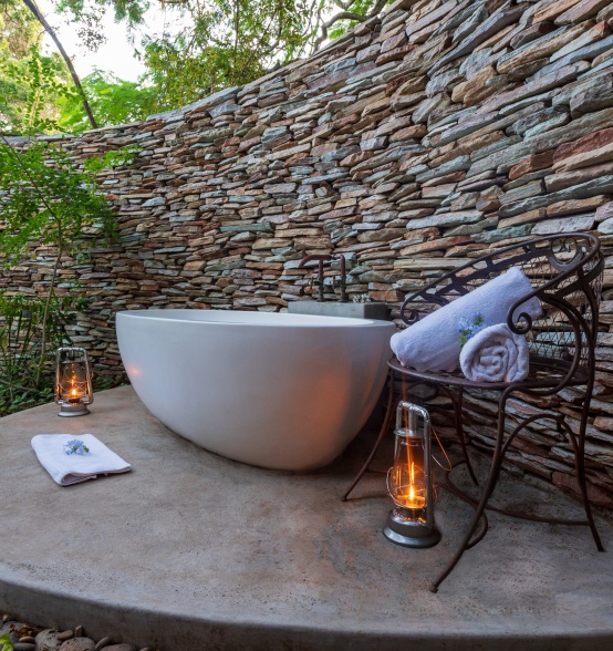 Selati Camp Luxury Suite private courtyard that encloses a deep stone bath.