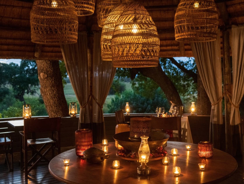 Marvel at the captivating nighttime glow of Selati Camp's deck lights, a truly exquisite sight. Marvel at the captivating nighttime glow of Selati Camp's deck lights, a truly exquisite sight.