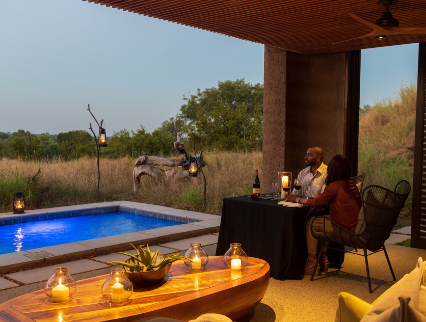 Sabi Sabi guests on a romantic getaway enjoying a meal while overlooking the safari bush. Sabi Sabi guests on a romantic getaway enjoying a meal while overlooking the safari bush.