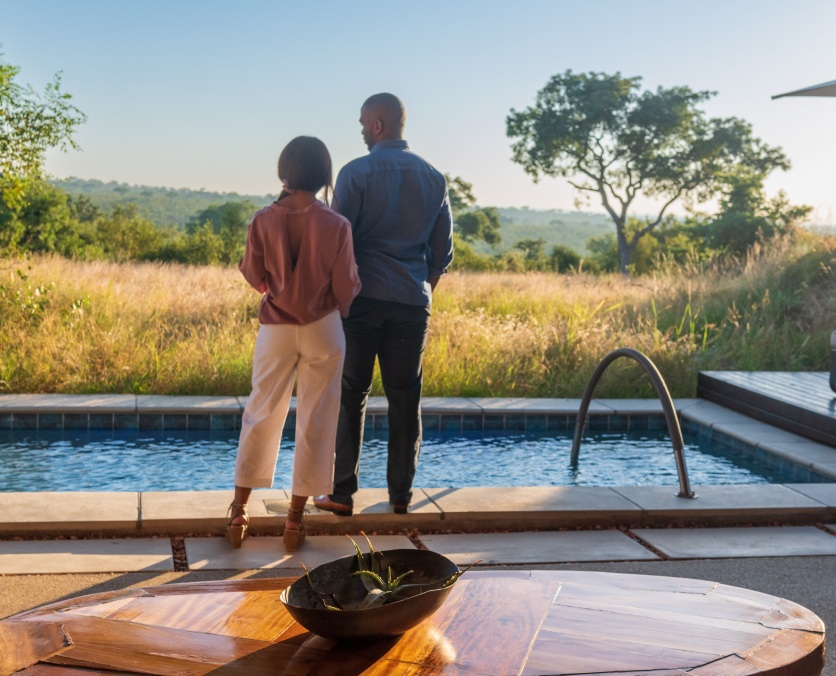 Sabi Sabi guests enjoying the endless views from the Earth Lodge Luxury Suite. Sabi Sabi guests enjoying the endless views from the Earth Lodge Luxury Suite.
