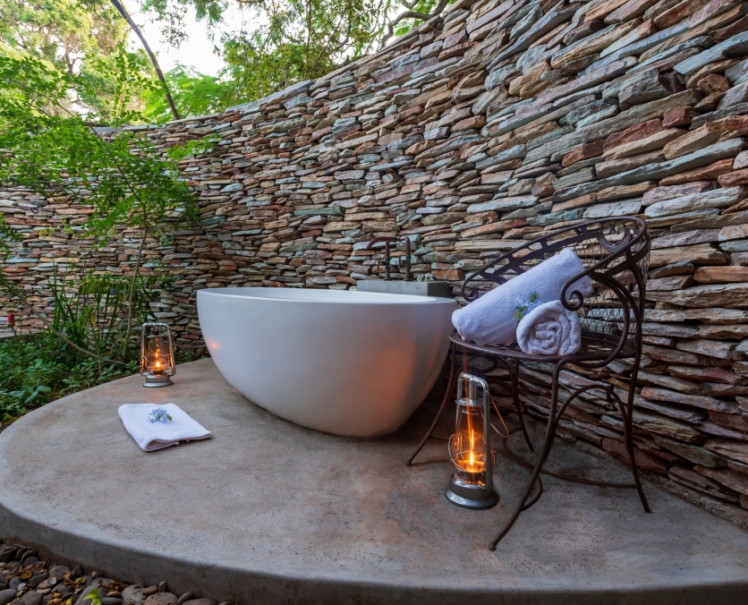 Selati Camp Luxury Suite private courtyard that encloses a deep stone bath. Selati Camp Luxury Suite private courtyard that encloses a deep stone bath.