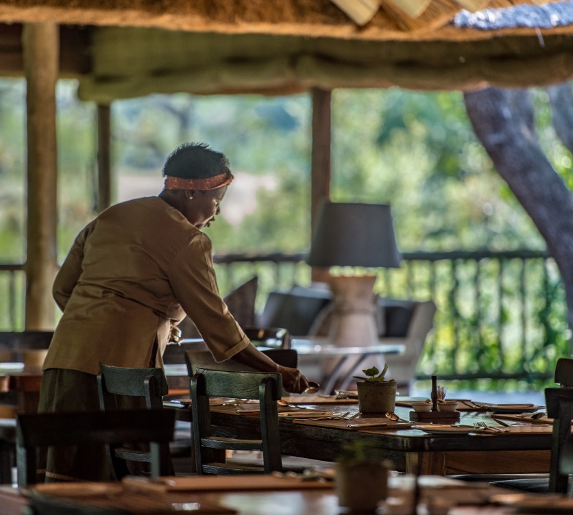 Enjoy the comfort and views of the thatched safari dining and lounge area at Bush Lodge.