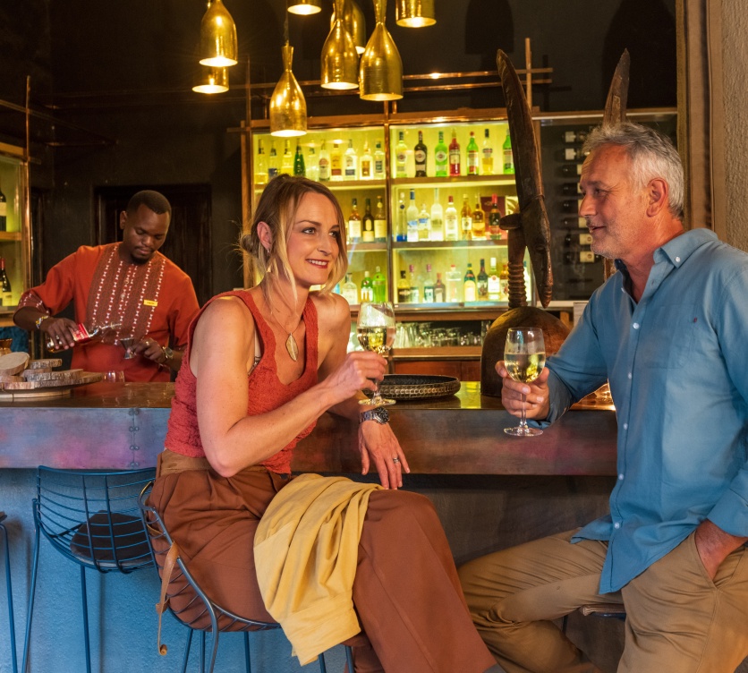Sabi Sabi couple enjoying premium wine at the Little Bush Camp bar.