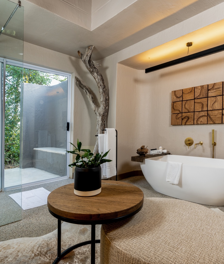 Soak in the serene ambiance and surroundings while enjoying a bubble bath at Sabi Sabi Bush Lodge.