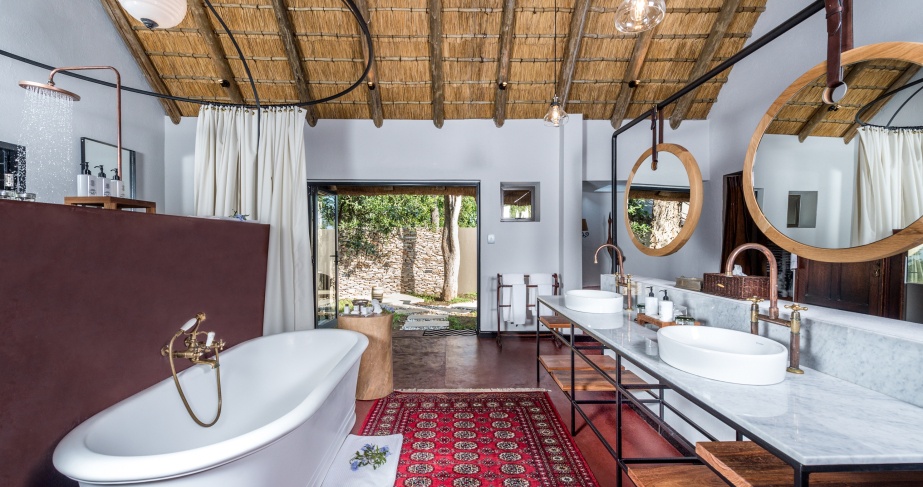 A palatial en-suite suite appointed in signature Selati Camp charm.