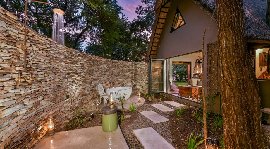 Bathe alfresco under the ancient African sky at Selati Camp.