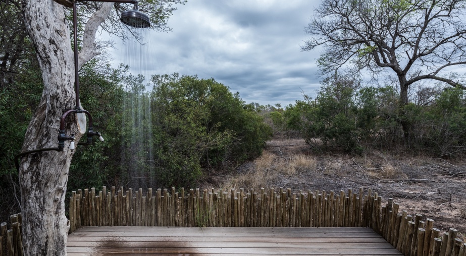 Feel the wind on your skin while having an outdoor shower at Sabi Sabi Luxury Villa.