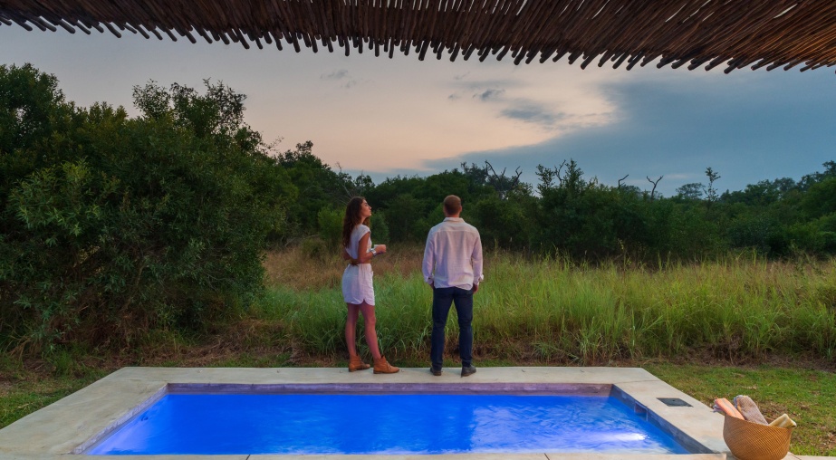 Luxury Villas at Sabi Sabi patio overlooking the private pool and waterhole beyond.