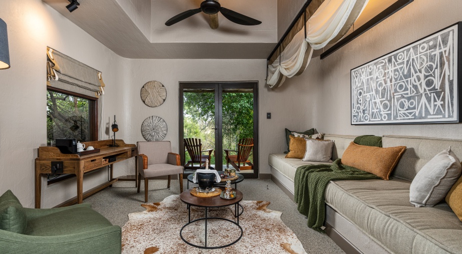 Step into the elegant and sophisticated lounge area of our bush lodge suite, where luxury and comfort intertwine flawlessly. Step into the elegant and sophisticated lounge area of our bush lodge suite, where luxury and comfort intertwine flawlessly.