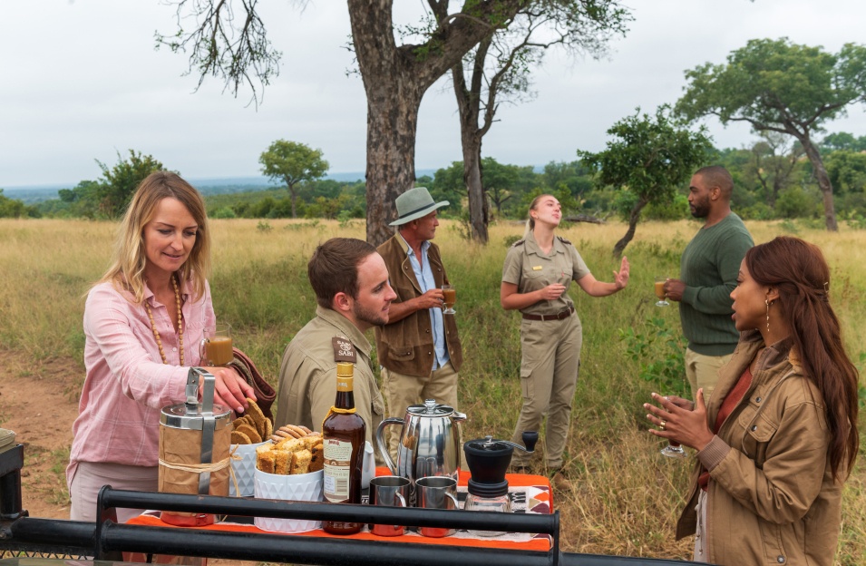 Safari tourists having light breakfast and interacting with expert Sabi Sabi guides. Safari tourists having light breakfast and interacting with expert Sabi Sabi guides.